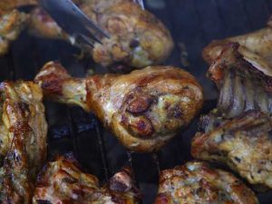 barbecued chicken on grill