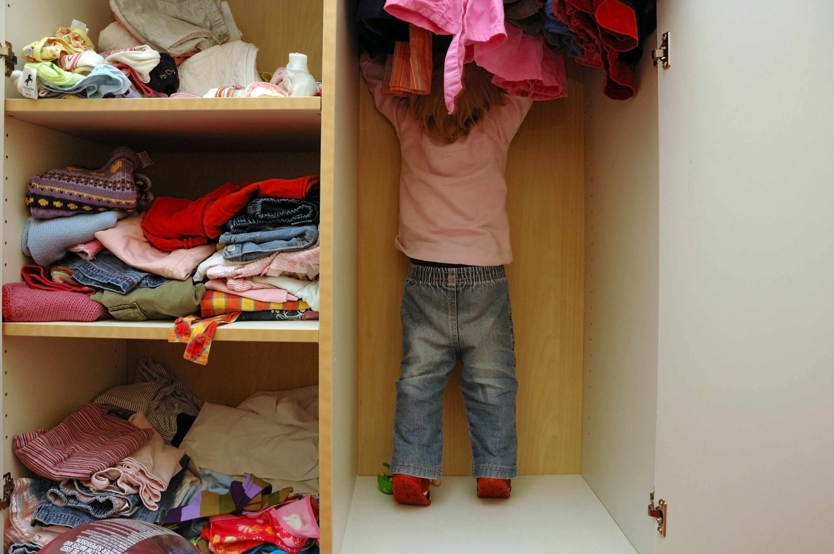 Closet with little girl in it