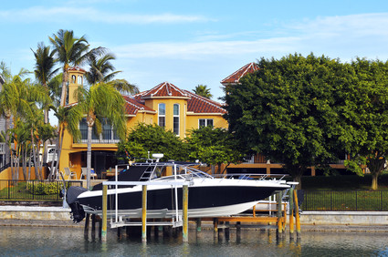 Boat in front of luxury home