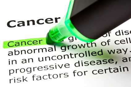 The word 'Cancer' highlighted in green with felt tip pen