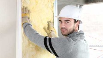 Worker Installing insulation