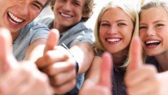 Photograph of Happy Young People with Thumbs Up