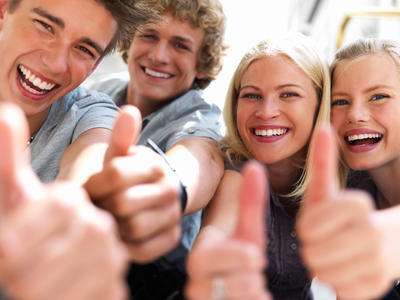 Photograph of Happy Young People with Thumbs Up
