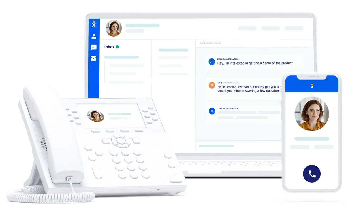 Nextiva marketing image of its contact center inbox on a laptop, with a desk phone and the mobile app