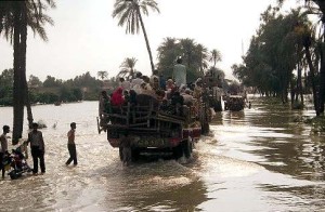 Pakistani flood survivors move to safe areas in Muzaffargarh near Multan, Pakistan on Tuesday, Aug. 17, 2010