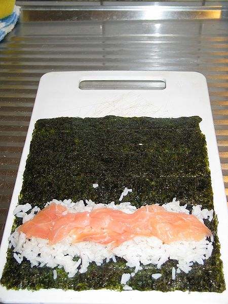 Preparing maki sushi.