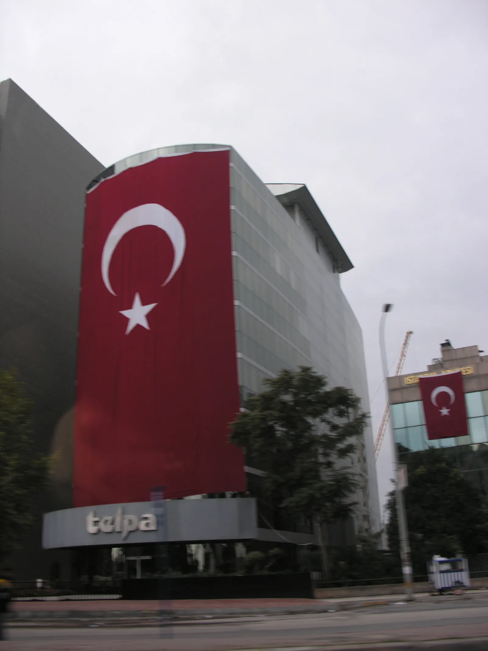 The Turkish flag flying against a blue sky